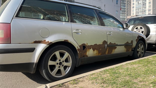 Silver car with rust, rotten steel, old car, damaged car photo