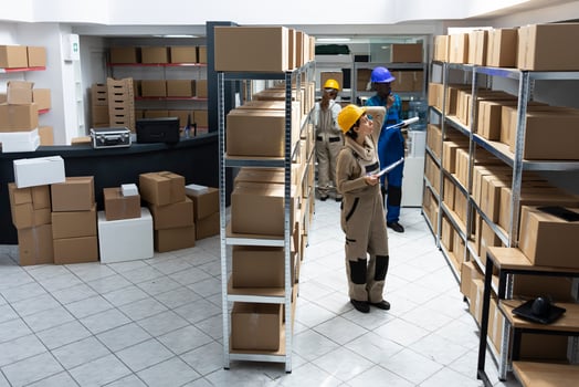 Female worker in a storage depot handles packages supply chain, managing inventory systems, focusing on storage organization and delivery services in a highly structured logistics center. photo