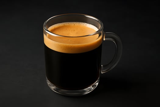 A glass of black coffee on a black background photo