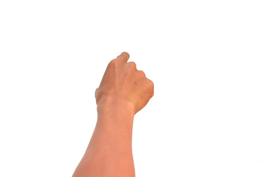 Close-up of a raised hand pointing upwards against a white background offering design flexibility photo