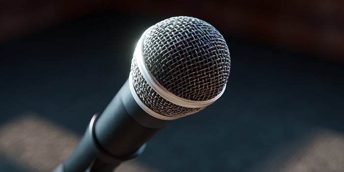 A microphone on stage at night. photo