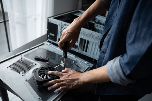 a Engineer installing Hardware fixing a computer case photo