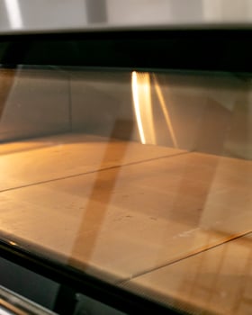 Golden rays dance on empty oven shelves, echoing a bakers anticipation, during Sourdough September and World Baking Day photo