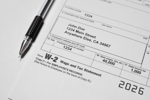W-2 Tax Form and Tax Statement on table photo