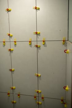 Wall Installation With Tile Spacers in a Modern Setting During a Renovation Project photo