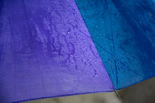 Edge of blue purple umbrella with metal spoke photo