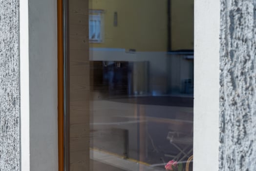 Modern store window with reflections of street and surroundings, ideal for branding mockups, advertising materials, or minimalist commercial visuals photo