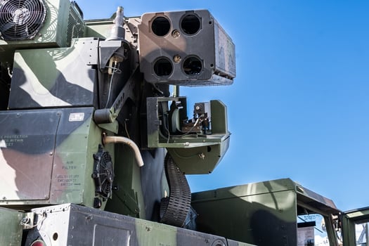 Anti-air gun mounted on the vehicle prepared for fire aimed in clear sky photo