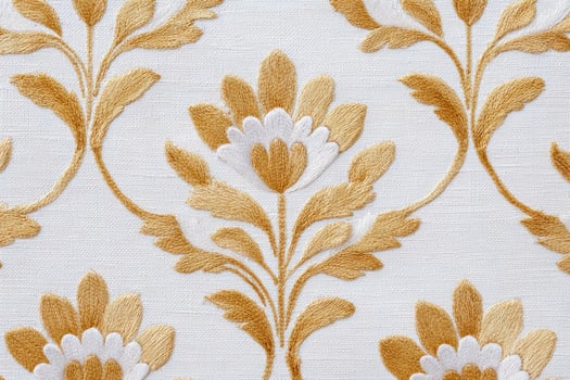 Intricate jaal pattern featuring floral motifs in golden hues on a textured white fabric, showcasing elegance and traditional craftsmanship in textile design photo