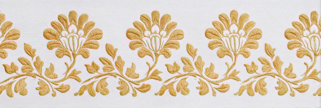 Jaal pattern featuring intricate floral designs in golden hues on a white background, showcasing elegant craftsmanship and traditional artistry in textile design photo