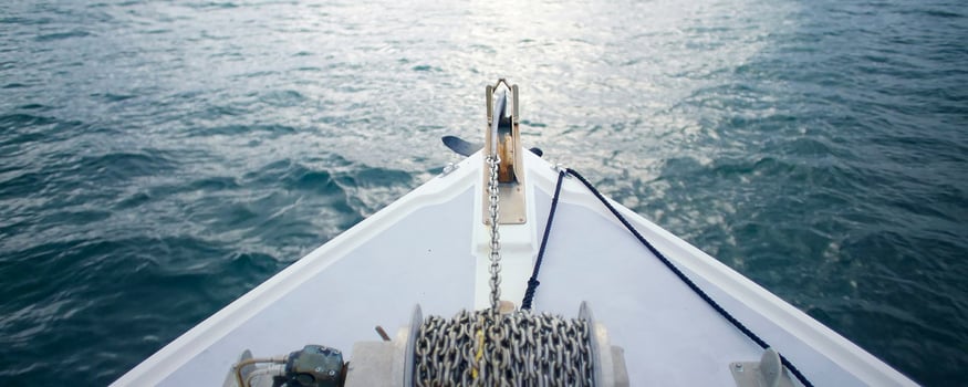 Bow of a boat on calm water. photo