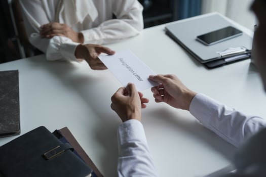 Business man sending resignation letter in office photo