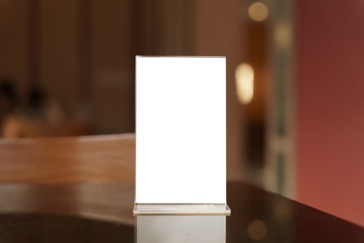 blank white menu mock up on table in restaurant. photo