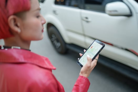 Traveler Gen z girl with red hair holding a cell phone photo