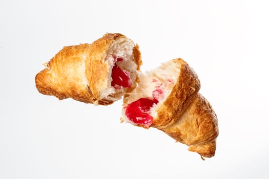Croissant with stuffing on a white background photo