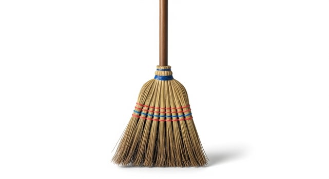 An old broom isolated on white photo