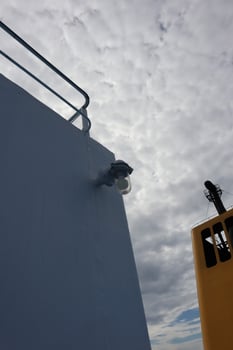A yellow truck with a camera on top of it photo