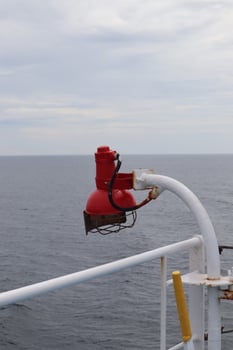 A red fire hydrant on a boat photo