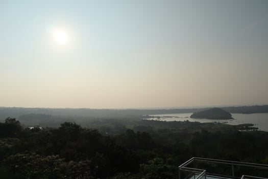 A view of a lake and a city from a hill photo