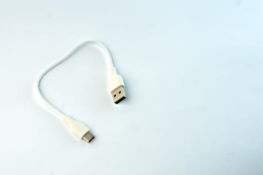 White USB to Micro USB cable for fast charging and data transfer. Compact and durable, ideal for smartphones, tablets, power banks, and other electronic devices photo