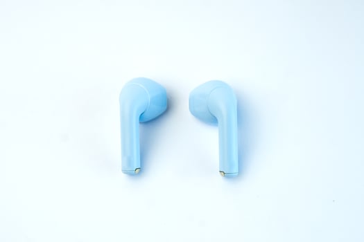 Minimalist blue wireless earbuds with an ergonomic fit and premium sound quality. Designed for music, calls, gaming, and workouts. Compact, lightweight, and noise-reducing. photo