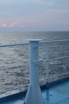 The view from the deck of a ship at sunset photo