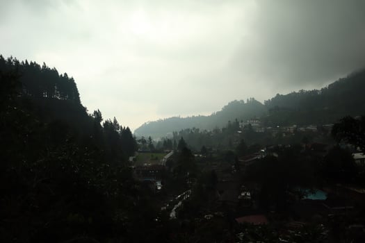 A cloudy sky over a mountain range photo