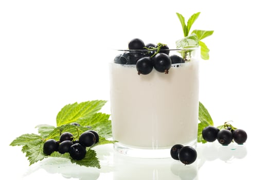 Sweet homemade yogurt with berries on white background photo