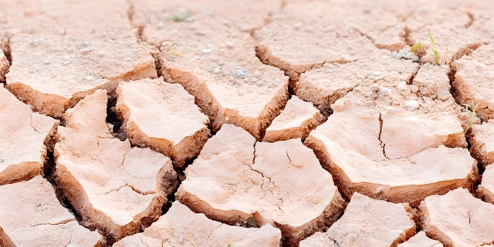 Dry Cracked Earth Ground Texture Light Brown Desert Soil photo