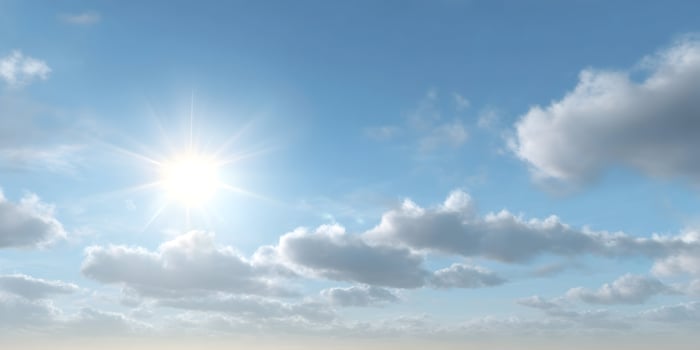 Bright Sun Shining in Partly Cloudy Sky Daytime Scene photo
