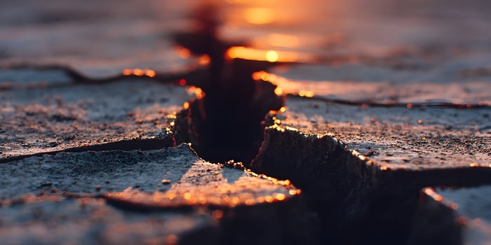 Sunset Glowing on Cracked Dry Earth Ground Closeup photo
