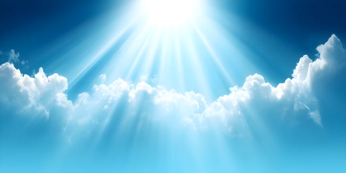 Bright Sunlight Rays Shining Through Fluffy White Clouds Blue Sky Background photo