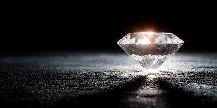 Brilliant Cut Diamond Gemstone on Dark Background Closeup photo