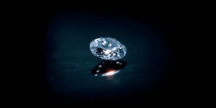 Brilliant Oval Cut Diamond Gemstone on Dark Background photo