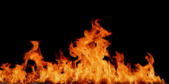 Fiery Flames Burning Bright Isolated on Black Background Intense Hot Fire photo