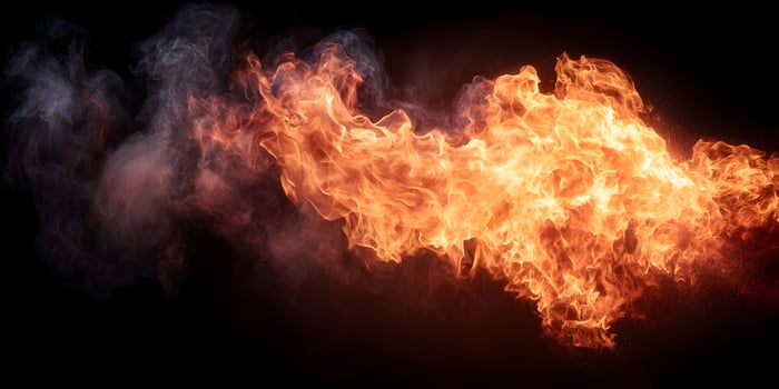 Fiery Orange and Gray Smoke Explosion on Black Background photo