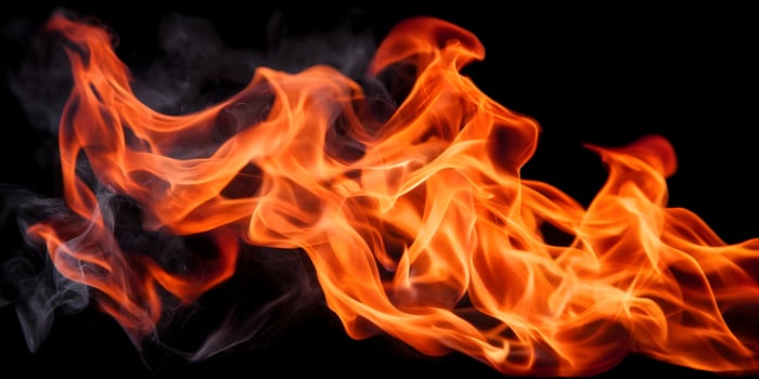 Abstract Fire Flames Burning Bright Orange and Yellow Isolated on Black Background photo