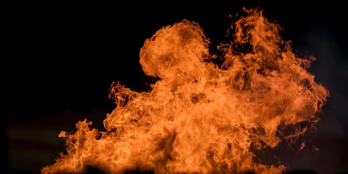 Fiery Orange Flames Burning Bright Against Black Background Intense Fire Photography photo