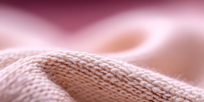 Closeup Knit Fabric Texture Pale Pink Beige Color Soft Material photo