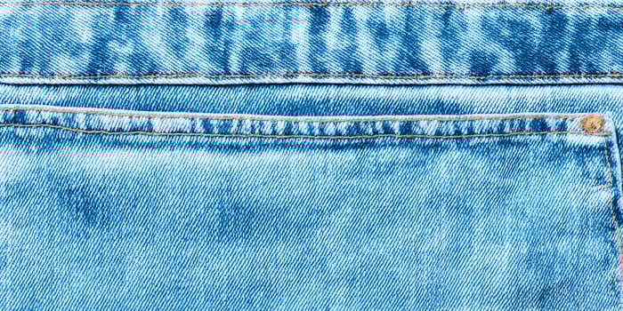 Light Blue Jeans Back Pocket Denim Texture Close Up photo