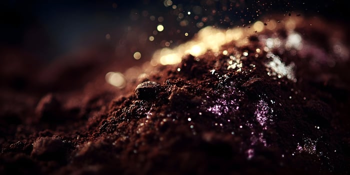 Dark Brown Coffee Grounds Texture with Golden and Purple Glitter Sparkling Dust photo