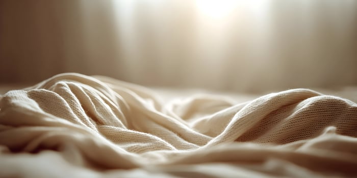 Cream Knitted Fabric Texture Background Soft Cozy Warm Light Sunlit photo