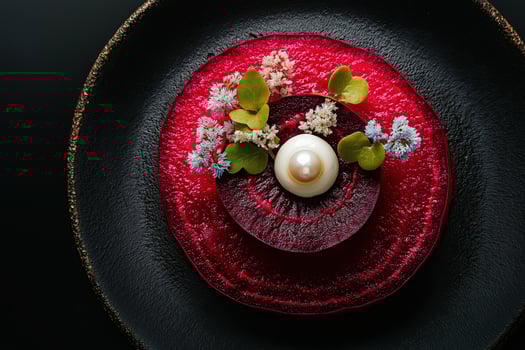 Beetroot carpaccio with pearl and flowers elevating fine dining experience photo