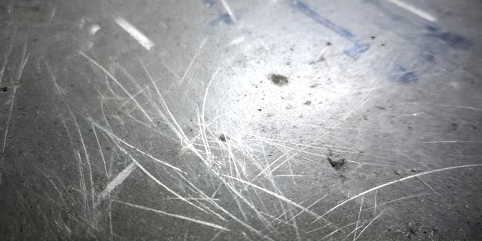 Scratched Metal Surface Texture Grey Background photo