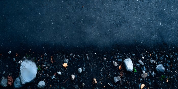 Dark Asphalt Road Texture with Small Rocks and Pebbles photo