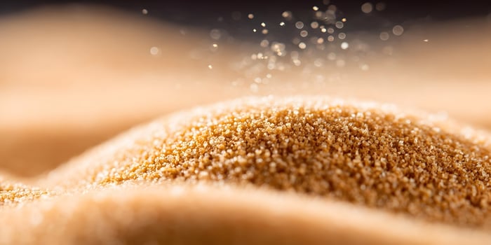 Brown Sugar Crystals Pile Closeup Detailed Texture photo