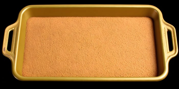 Gold Baking Pan Filled with Brown Sugar Crust photo