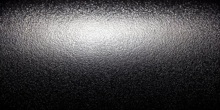 Dark Gray Textured Surface Illuminated Background photo