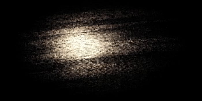 Dark Textured Fabric Background Illuminated Center Beige Tones photo