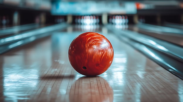 A Red Bowling Ball on the Alley Lane in Motion. photo